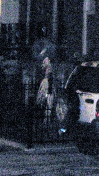 this a ghost in long dress is here next to car.JPG